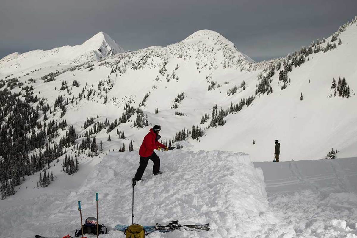 Riley Leboe shoveling away on January 9 to build the slopestyle venue for the Red Bull Cold Rush at Revelstoke, B.C. PHOTO: Bryan Ralph/Red Bull Content Pool