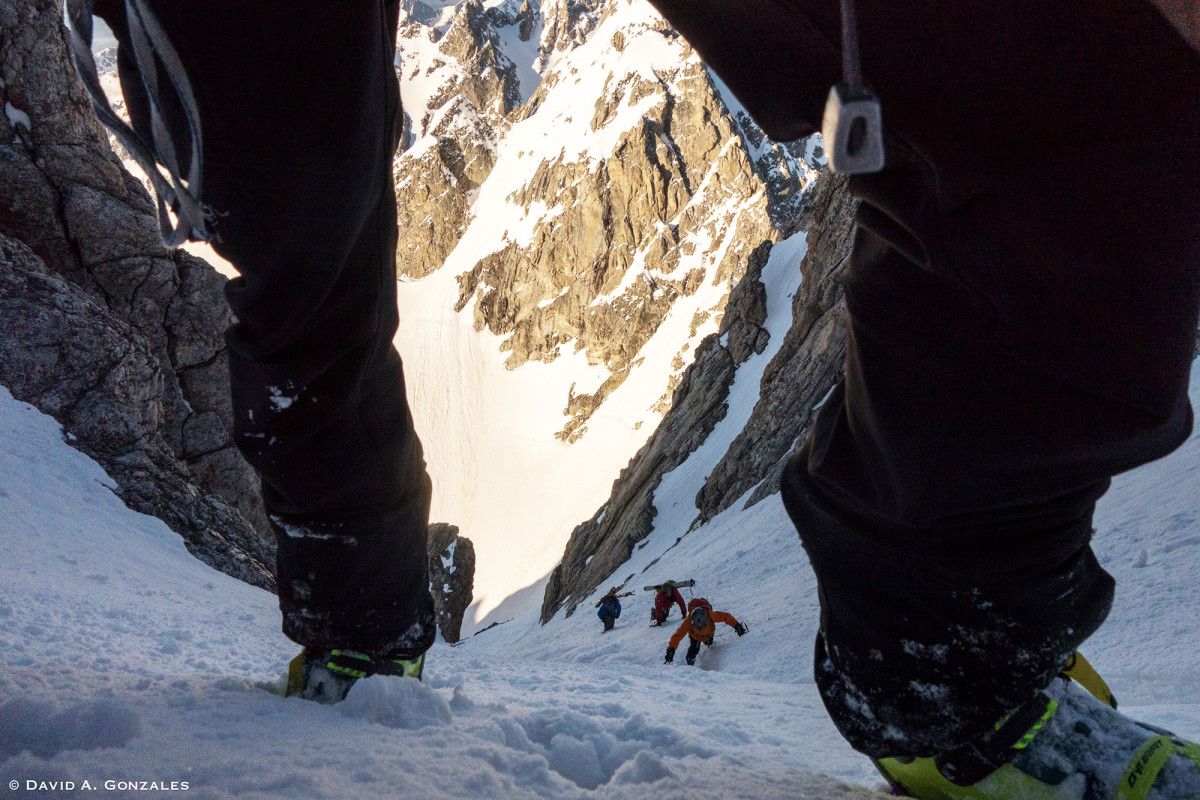 David Gonzales gets a nice view of Sasha, Hans, and Nancy Johnstone as they punch up the firm snow in the Grand Teton's lower Stettner Couloir.
