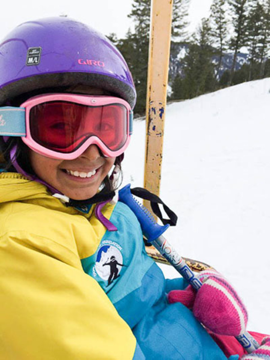 Deyna Lira, 10, flashes a smile during her Saturday morning ski lesson at Snow King. She says she loves wipe-outs the most and she said, “I like it when snow flies over my head." PHOTO: Danielle Shapiro