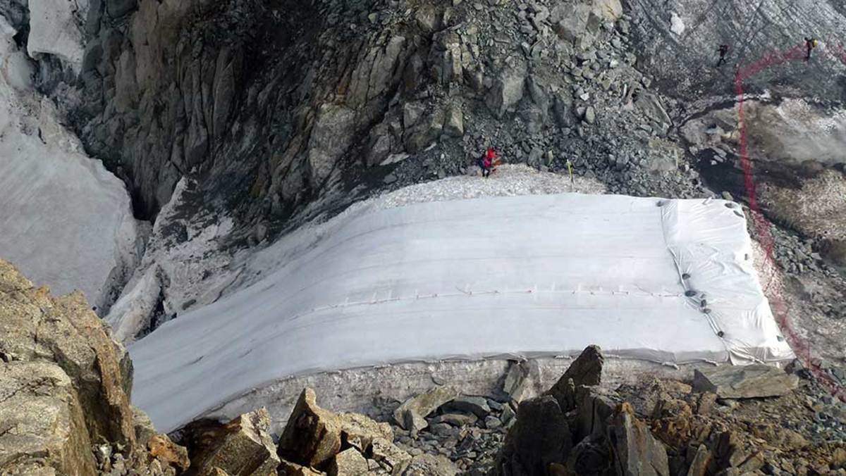 Skiing Grands Montets in the winter may be saved in part by a 7,500-square-foot, heavy-duty tarp that stretches over the top of the Rognons Glacier from May to October. PHOTO: Luc Moreau