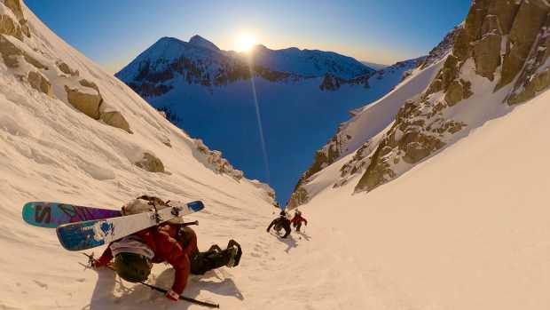 Skiers ascend a couloir in the Wasatch Mountains, Utah