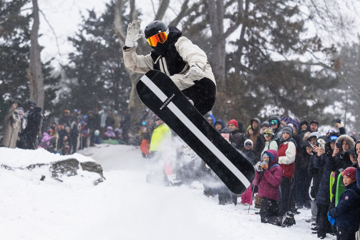 Olympian Delights Crowd by Snowboarding and Throwing Tricks in Central Park Amid Blizzard