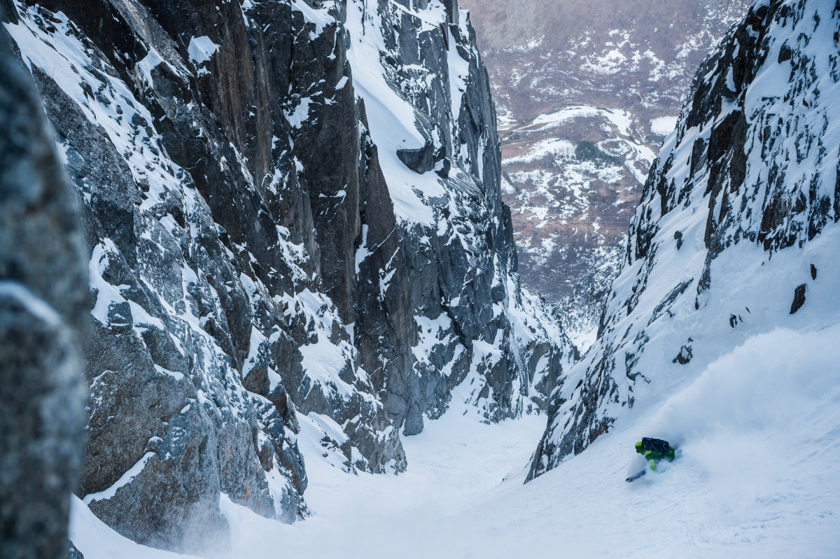 Chad Sayers skis the Skamdalsrenna in powder. Just days later, when the author arrived after a full day's approach, warming temperatures and rockfall turned the group around.